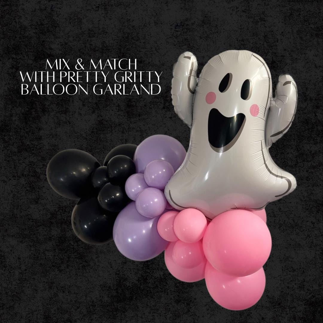 DIY Halloween balloon garland with white ghost face balloon and mix of pink, purple, and black balloons.