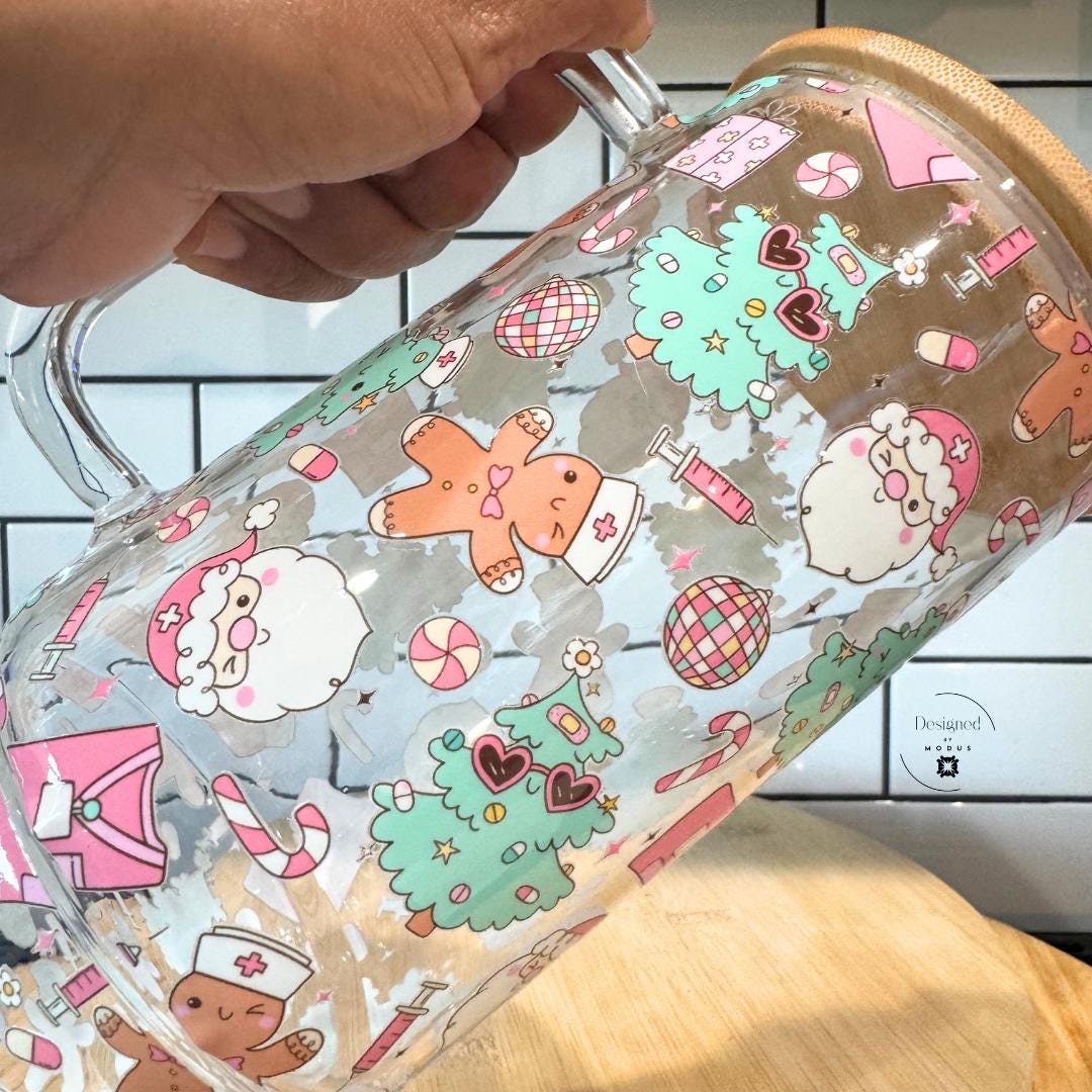 Hand-held shot showing clear handle and bamboo lid for Christmas glass tumbler