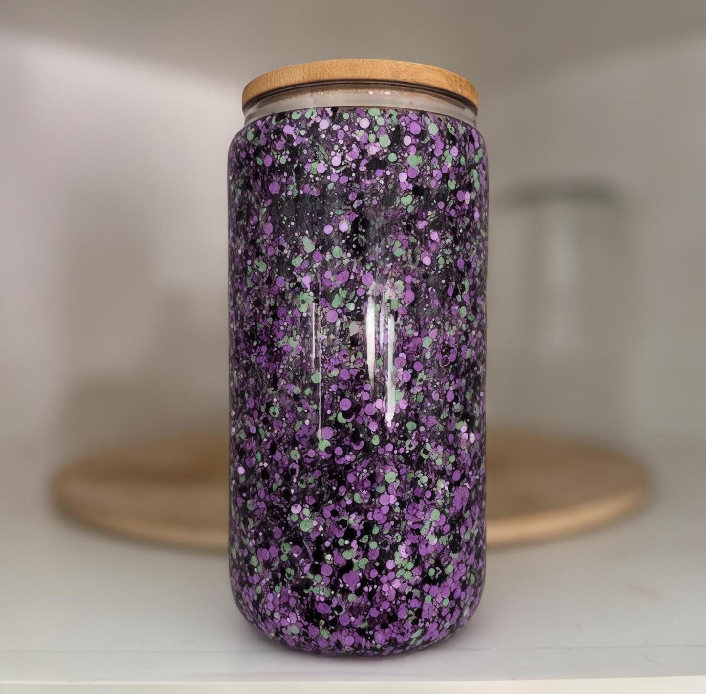 Purple, Black and Mint Sparkle Glass Tumbler with bamboo lid in white kitchen cabinet