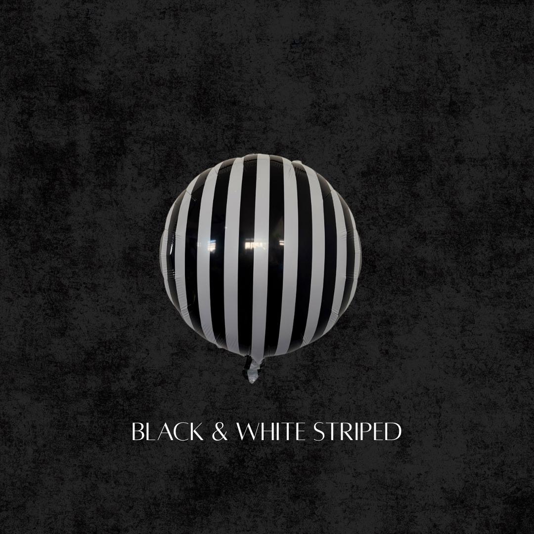 Black and white striped round balloon, Beetlejuice-inspired party balloon for Halloween decorations and balloon garlands.