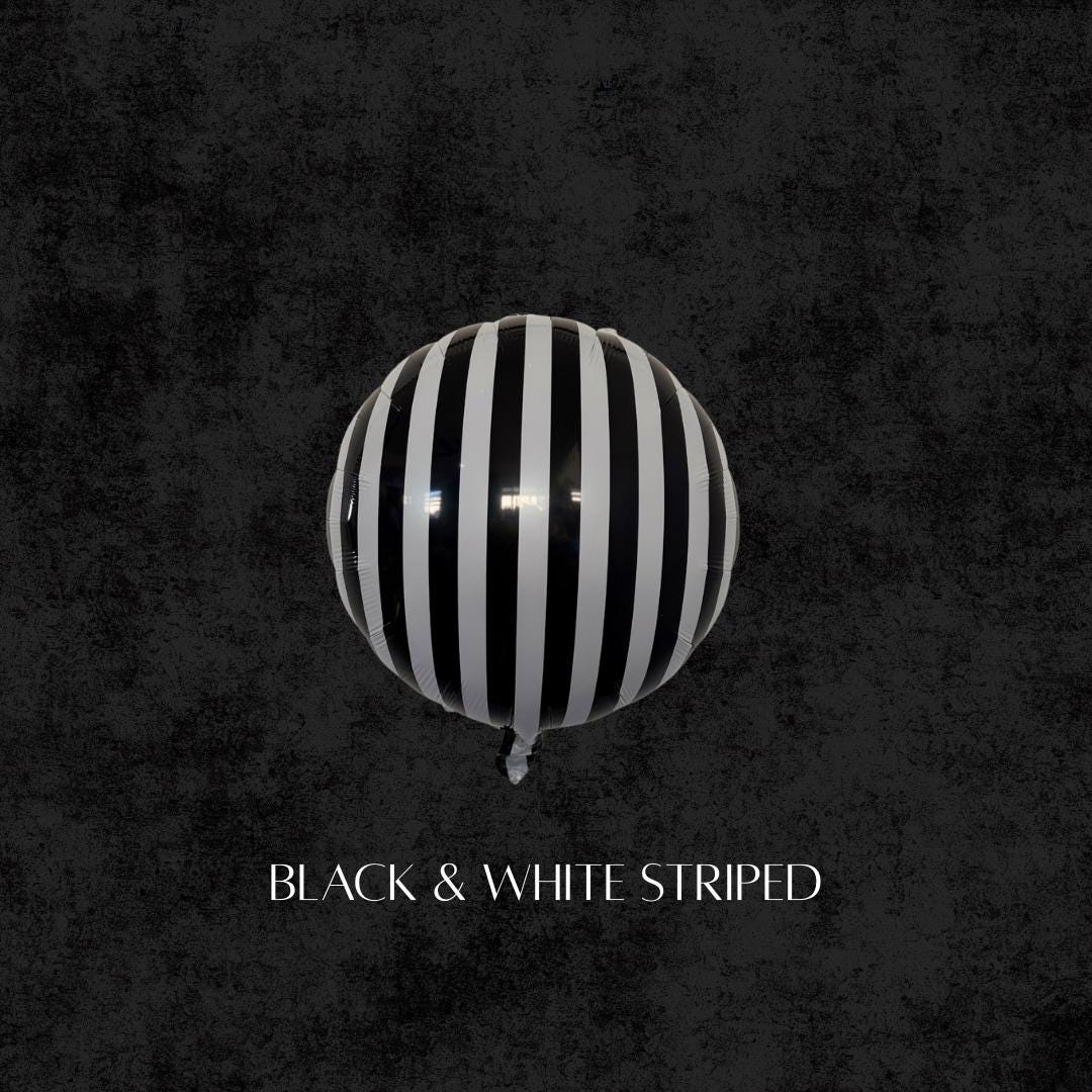 Black and white striped round balloon, Beetlejuice-inspired party balloon for Halloween decorations and balloon garlands.
