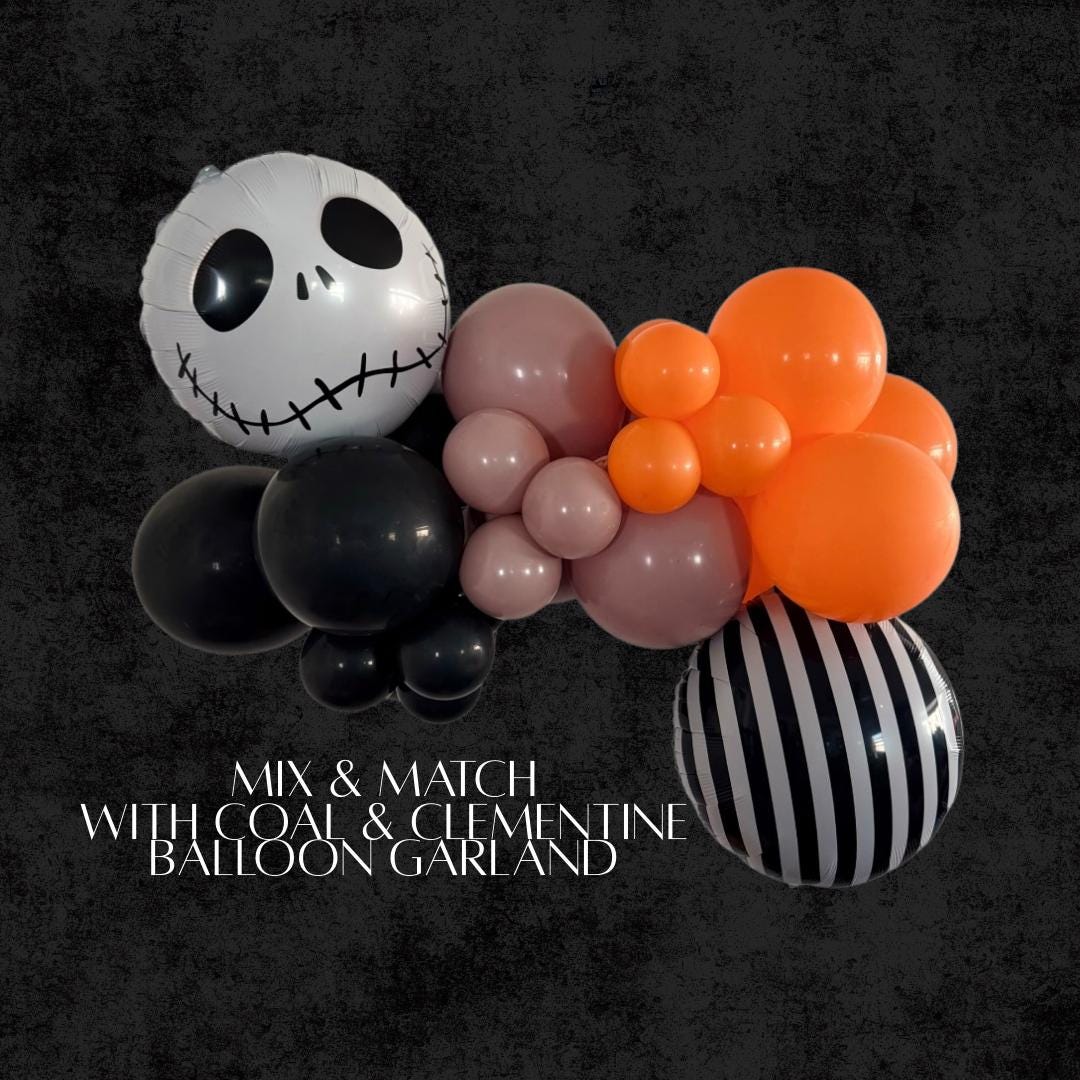 Halloween balloon garland kit with Jack Skellington foil balloon, black and white striped balloon, orange, black, and malted balloons.