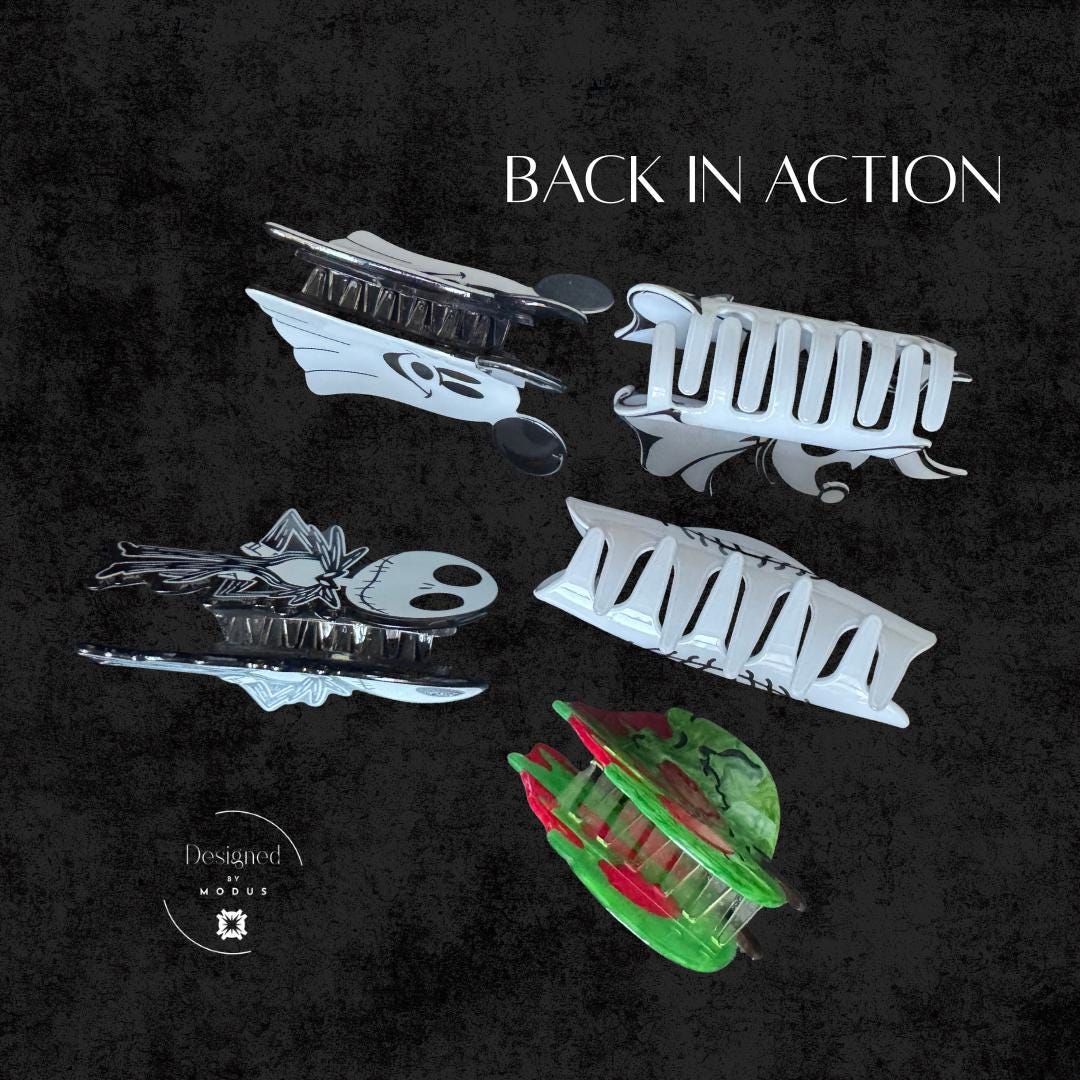 Set of Halloween claw clips showing sturdy clip backs in spooky designs.