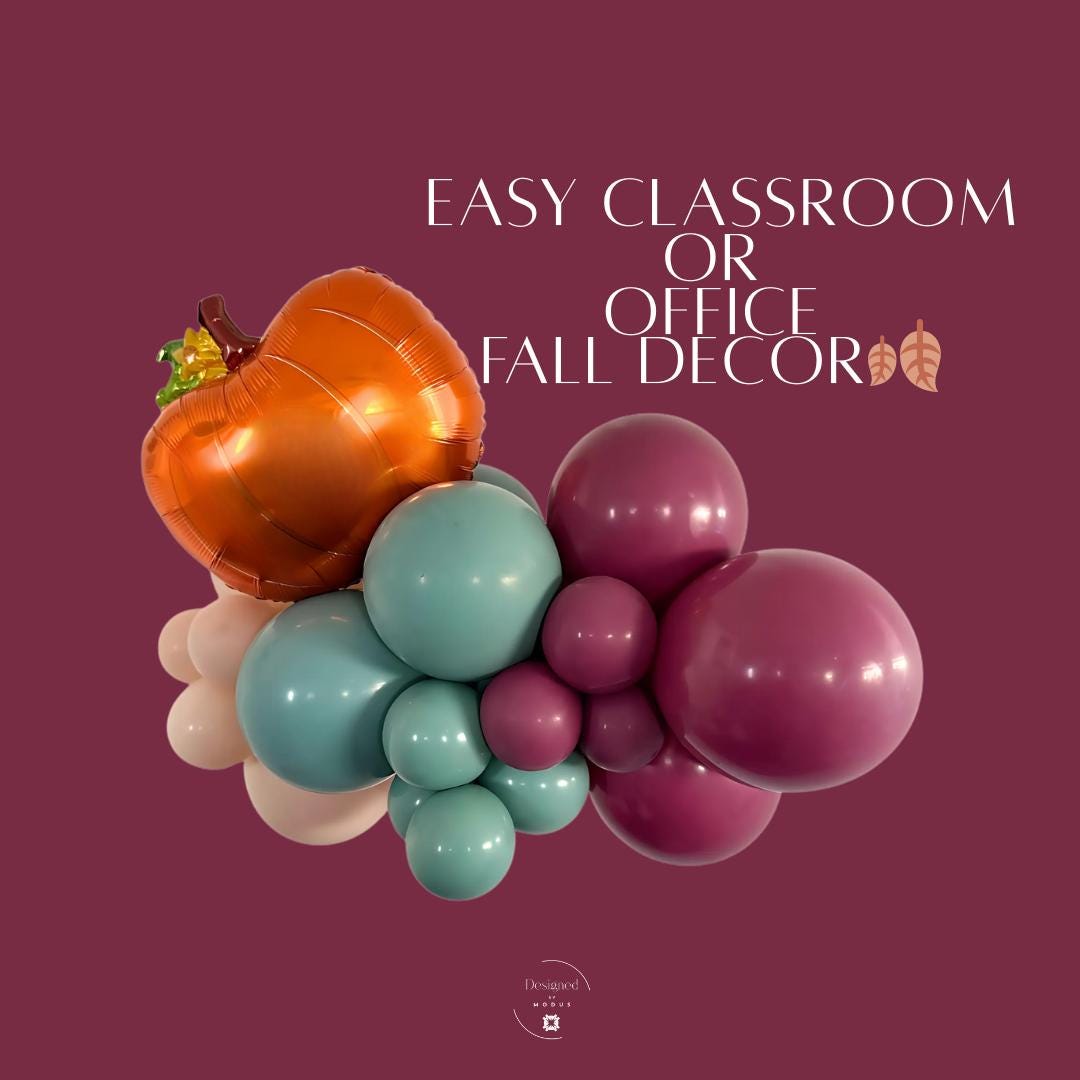 Orange pumpkin mylar balloon with teal and burgundy balloon garland, styled for easy fall classroom or office decorations.