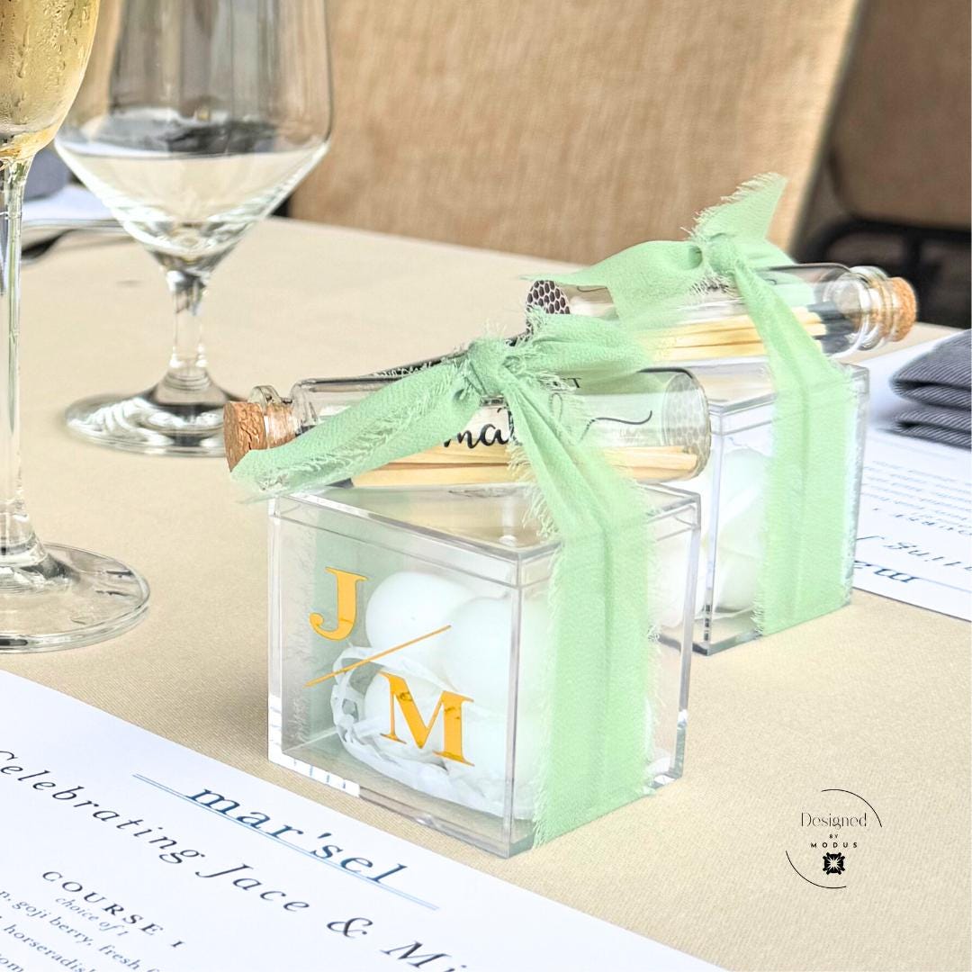 Personalized candle and match set engagement party favors with custom labels.