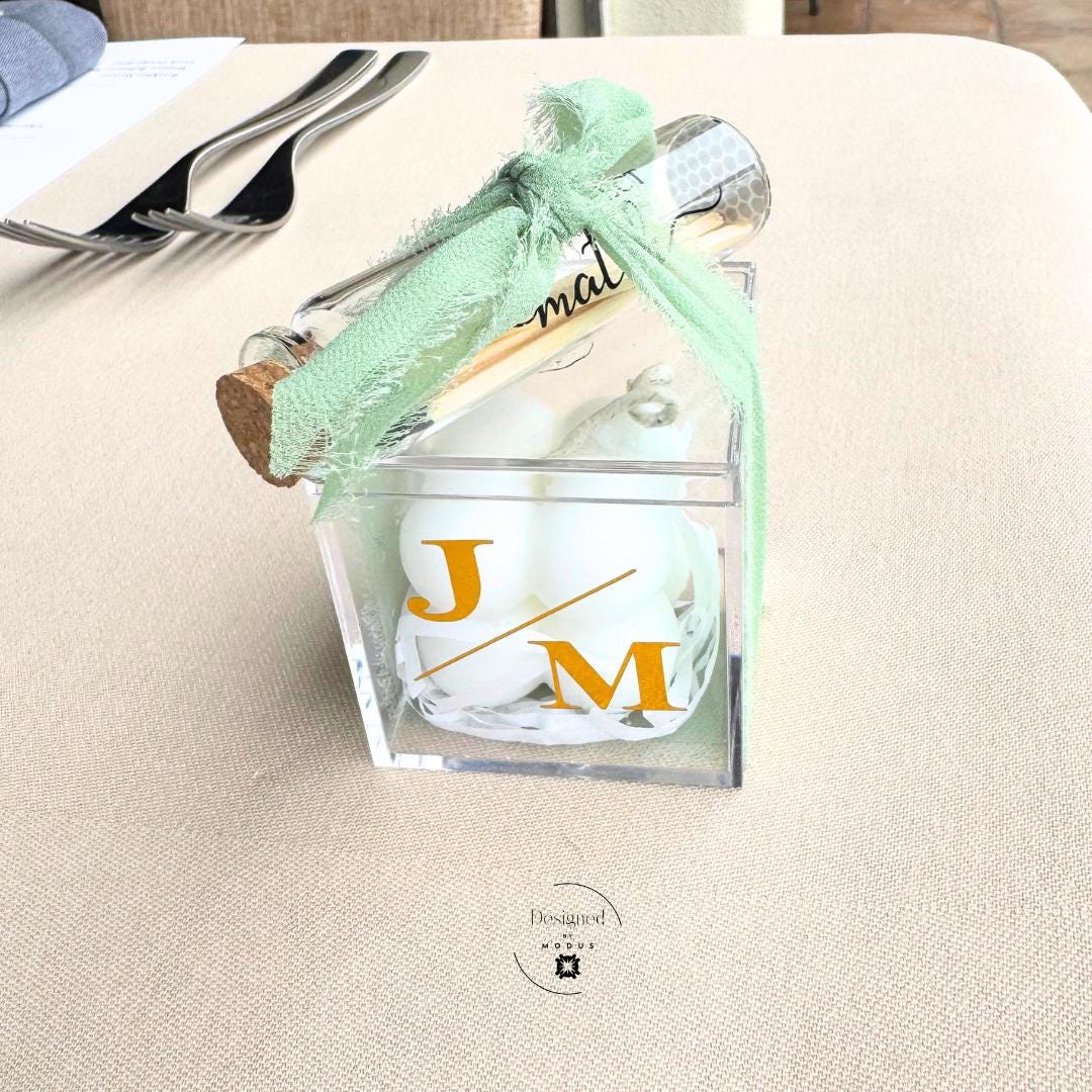 Personalized candle and match set engagement party favors with custom labels.