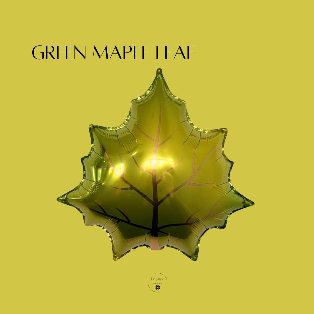 Shiny green maple leaf mylar balloon, perfect for fall parties, Thanksgiving décor, or autumn balloon garlands.