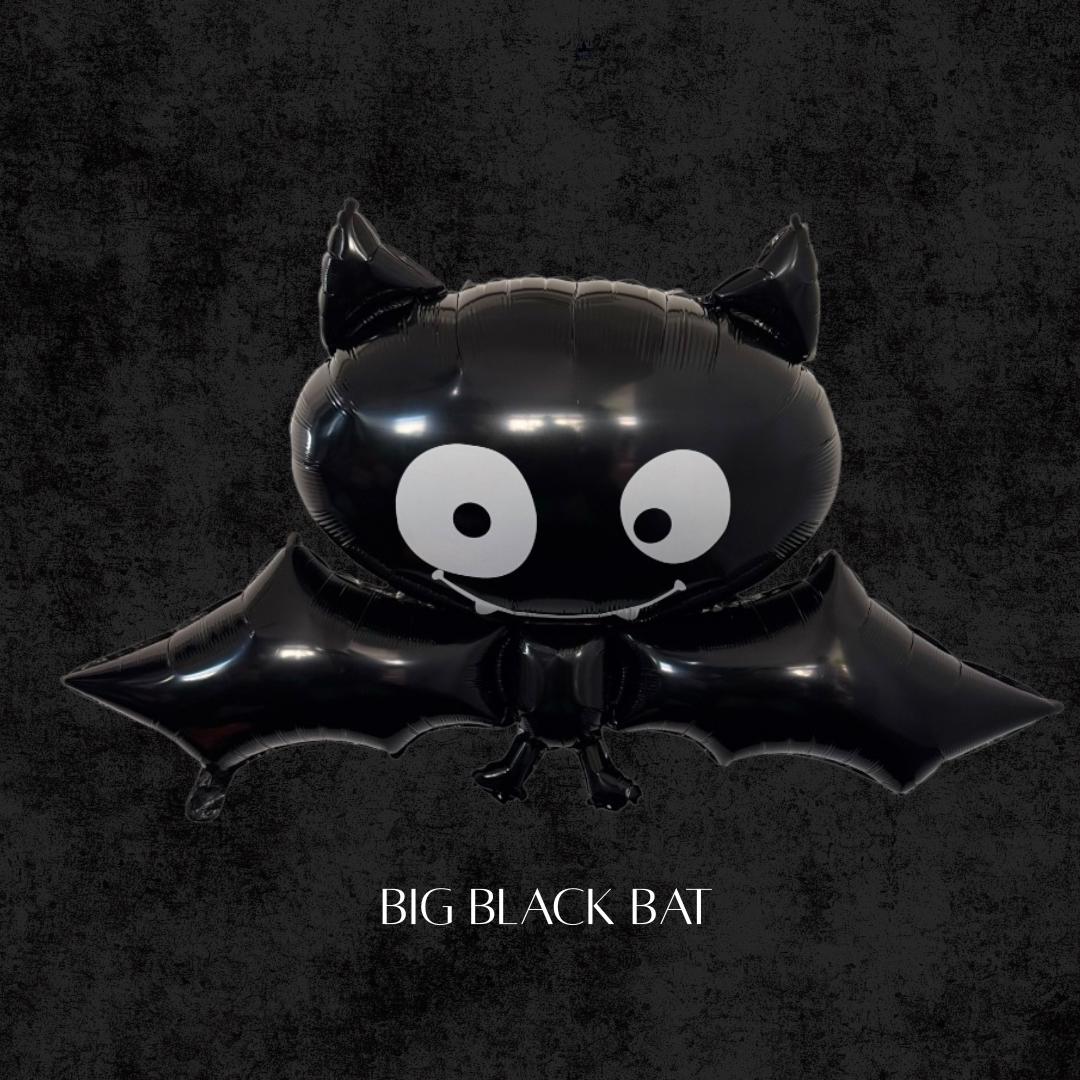Big black bat foil balloon with wide cartoon eyes, perfect for Halloween parties, spooky balloon arches, birthday backdrops, and trick-or-treat decorations.