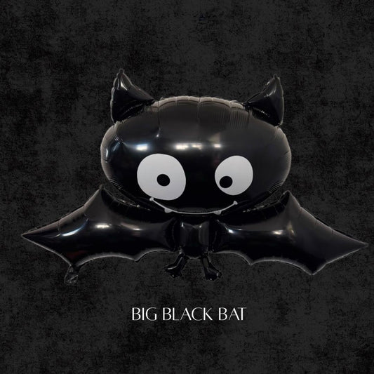 Big black bat foil balloon with wide cartoon eyes, perfect for Halloween parties, spooky balloon arches, birthday backdrops, and trick-or-treat decorations.