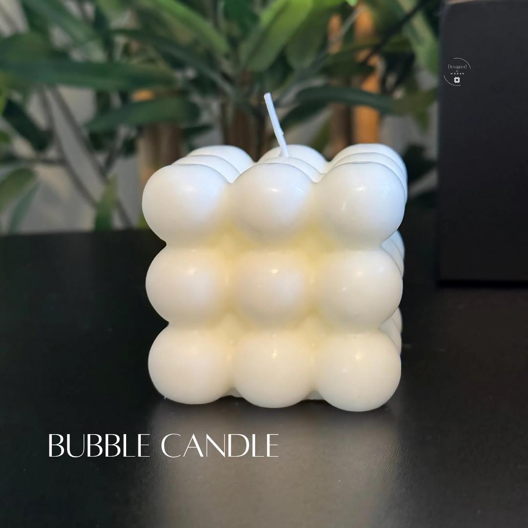 White bubble cube candle displayed on black surface, featured in holiday spa gift set for her.