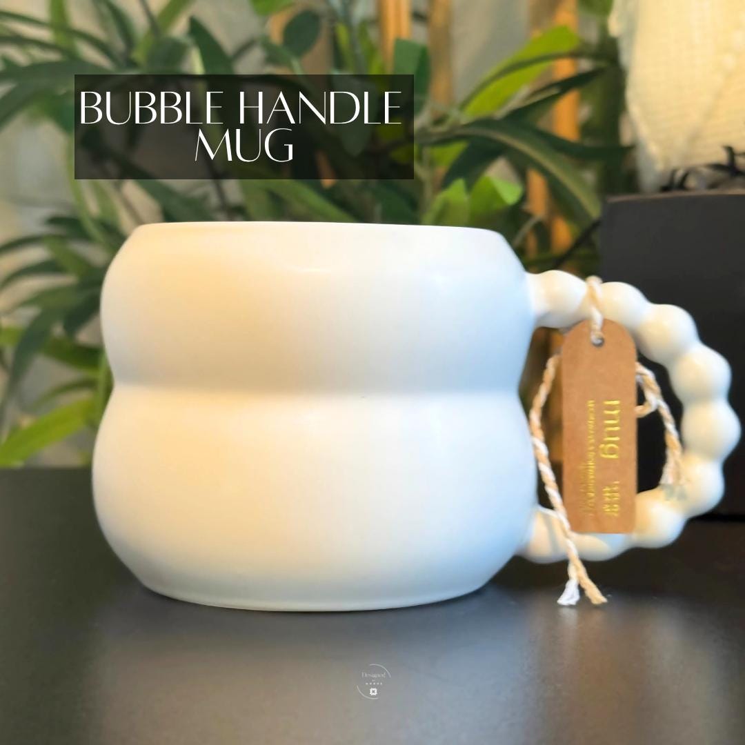 Modern white ceramic mug with bubble handle, part of luxury holiday gift box for her.