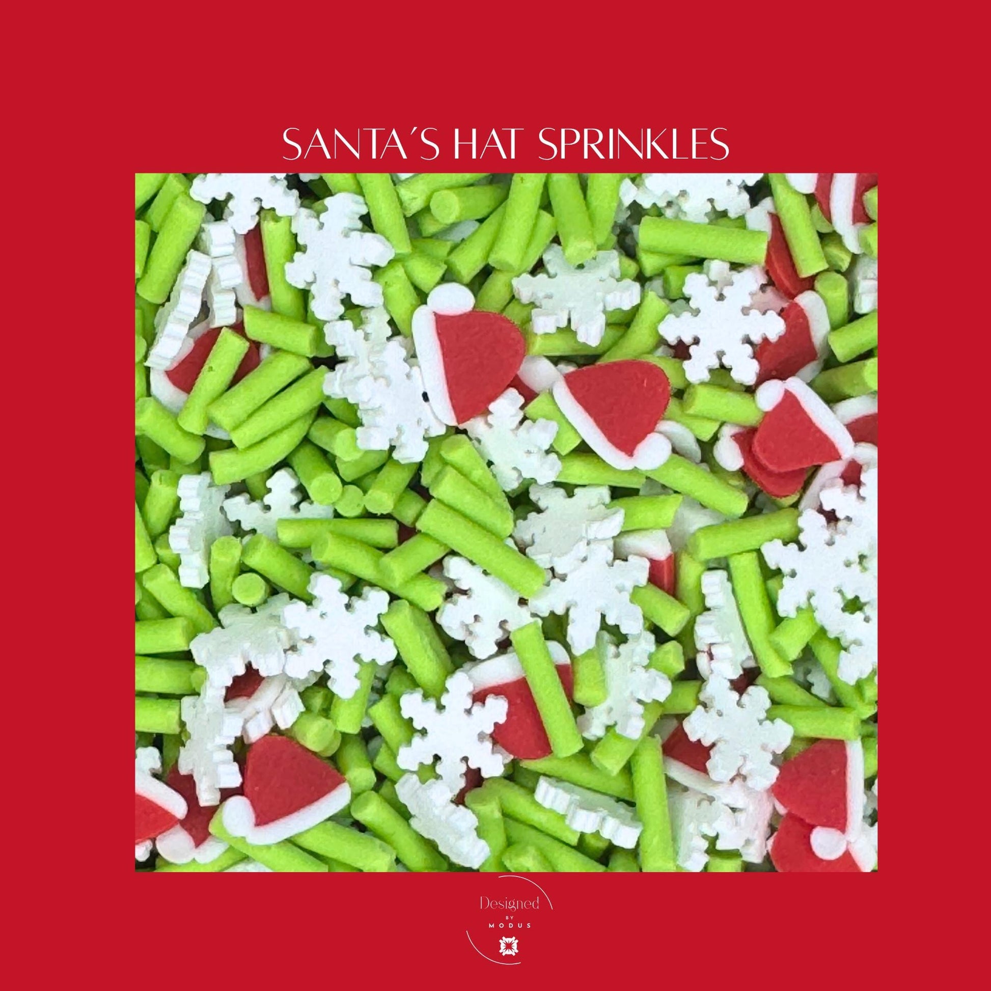 Close-up of Santa’s Hat sprinkles featuring mini red hats, green rods, and white snowflakes on a red background.
