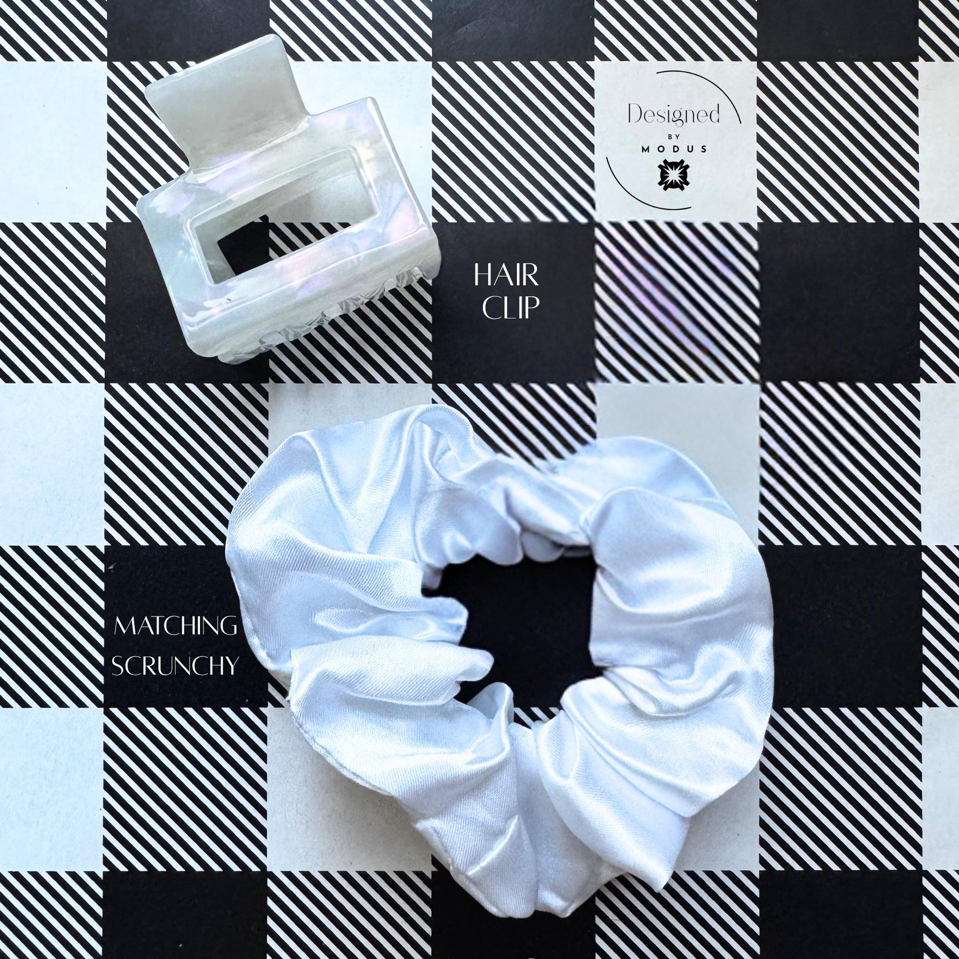 White satin scrunchie and iridescent claw clip displayed on plaid background, labeled “Matching Scrunchy & Hair Clip.”
