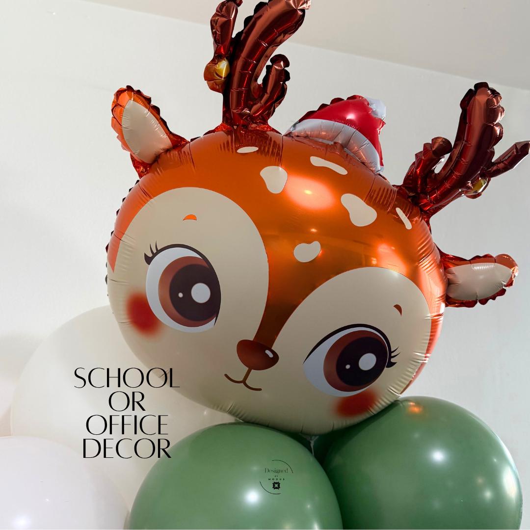 “Reindeer balloon with green and white latex balloons used for school or office holiday decor.”