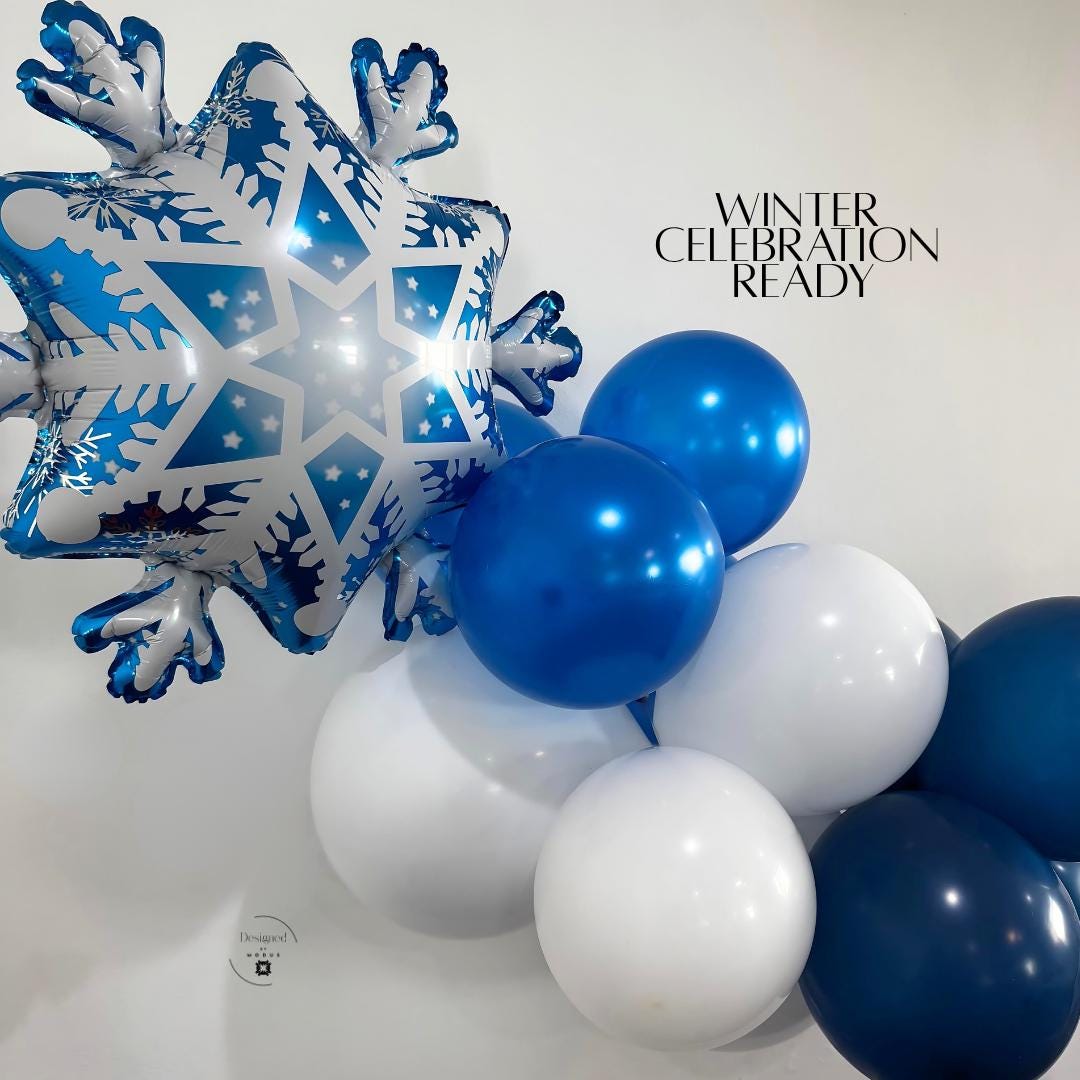 Snowflake balloon with blue and white latex balloons for Frozen party or winter wonderland theme.”