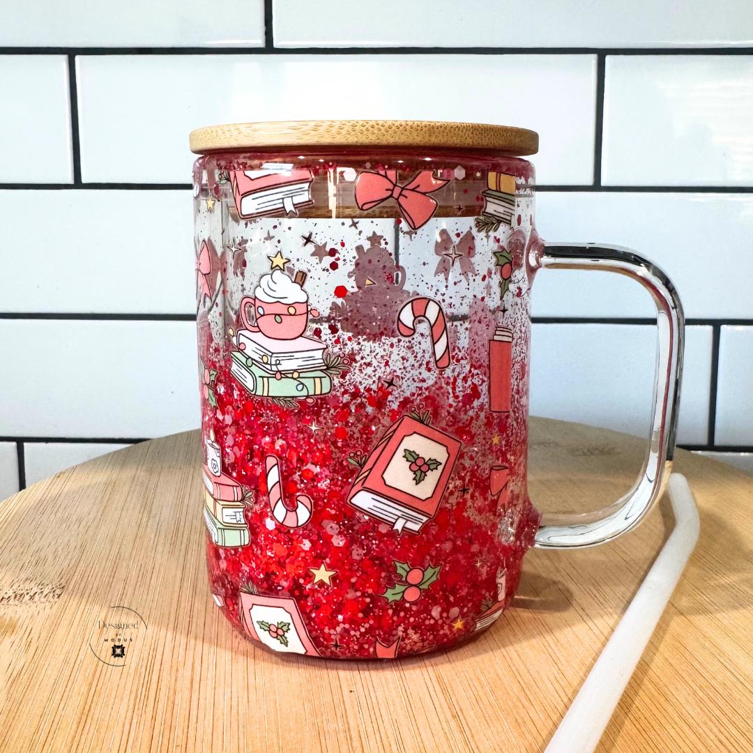 Holiday red glitter mug with handle and bamboo lid shown on wood surface.