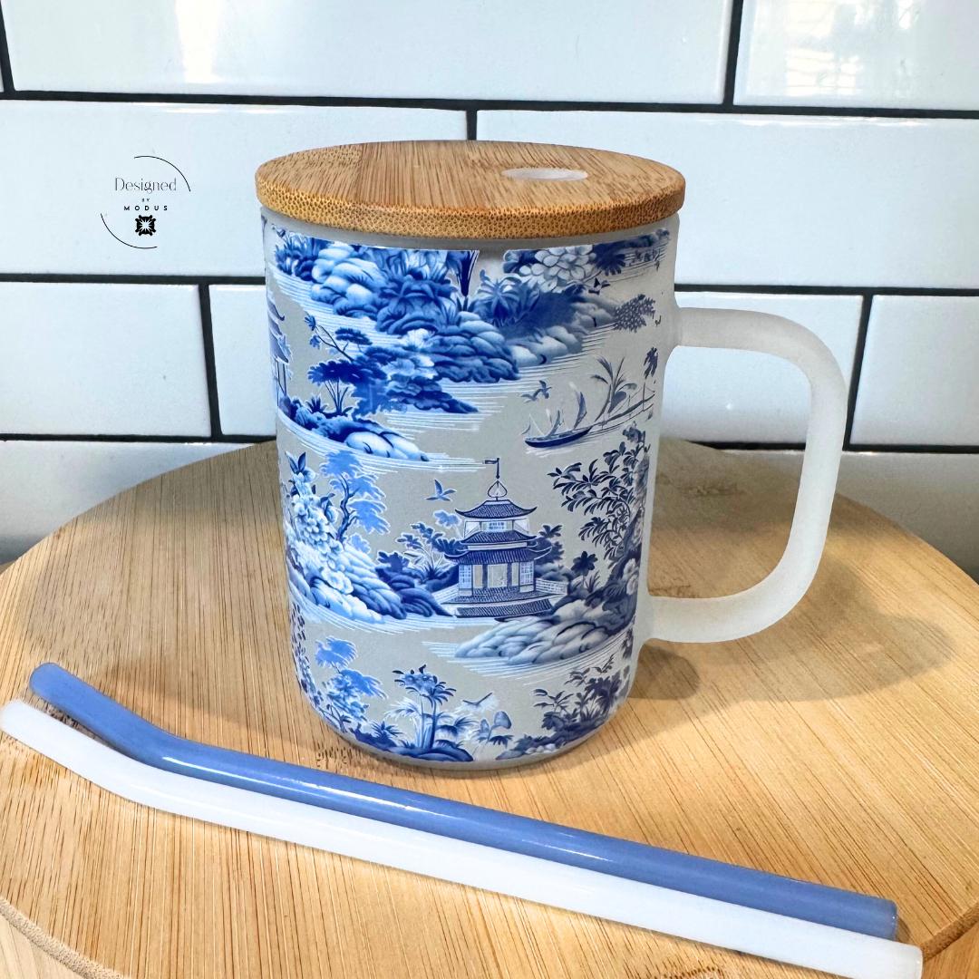 Overhead view of elegant frosted chinoiserie mug with lid and matching straws.