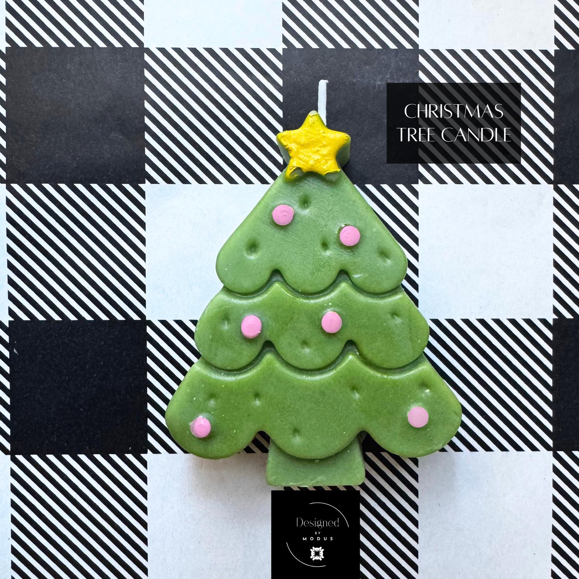 Green Christmas tree candle and gold decorative tree ornament labeled “Holiday Candle & Décor Accent.”