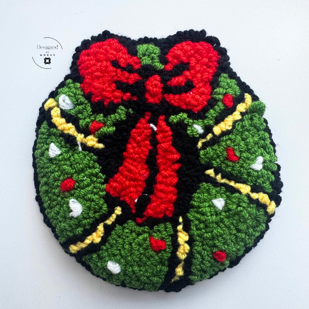 Christmas wreath punch needle coaster with red bow and green trim
