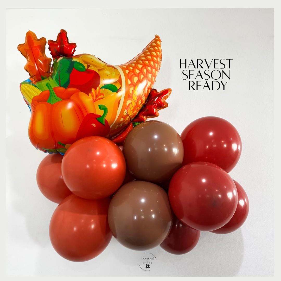“Cornucopia balloon displayed with brown, orange, and red latex balloons for harvest season party décor