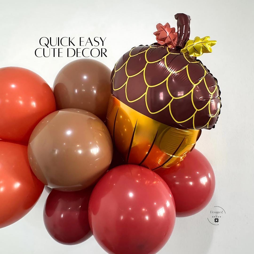 Fall acorn balloon paired with brown and orange balloons for Thanksgiving or harvest season display.