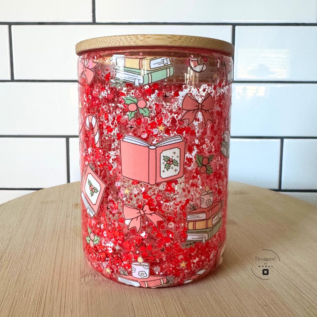 Front view of Christmas glitter cup with cocoa mug illustration and holly details.