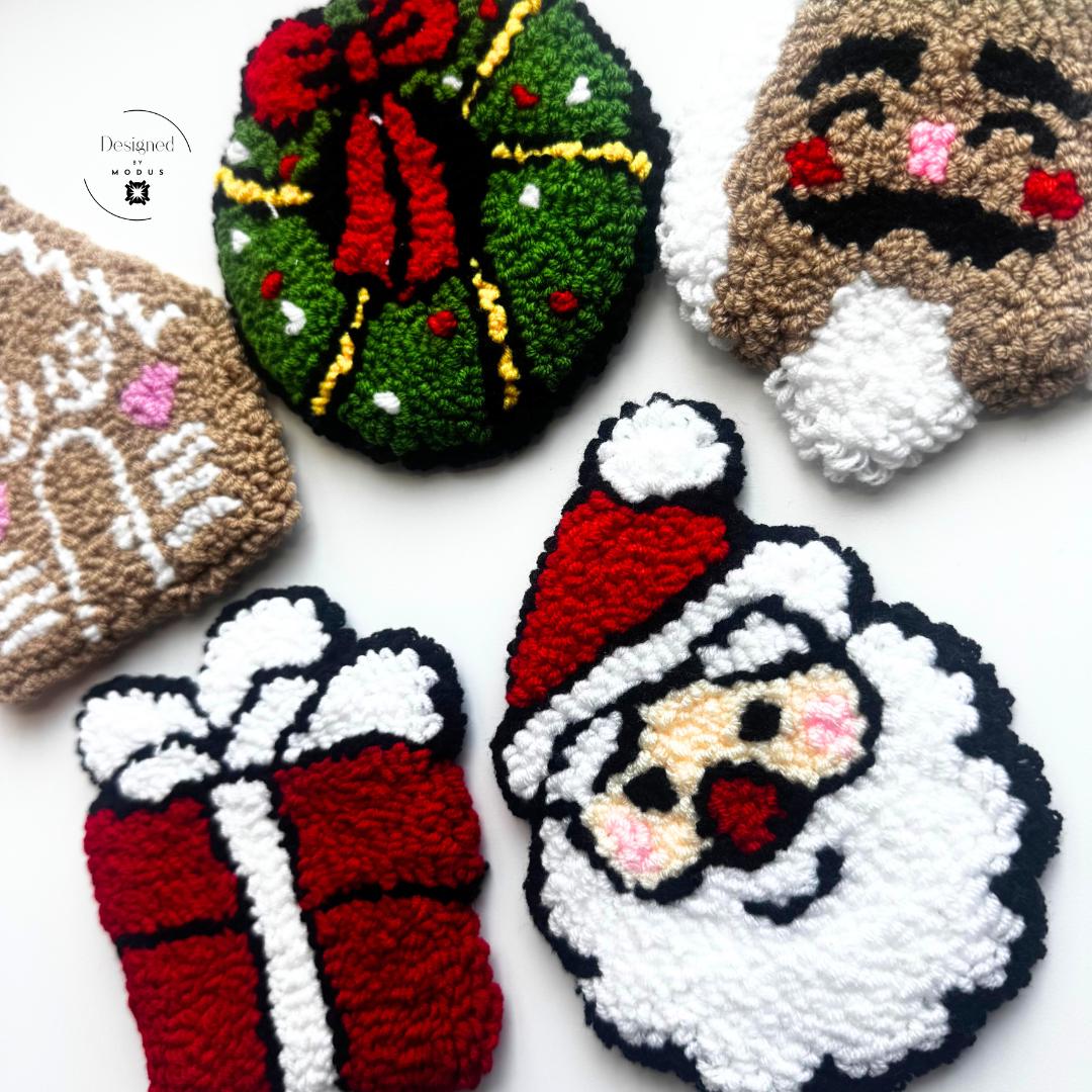 Five handmade punch-needle Christmas coasters — Santa, Wreath, Gift, Nutcracker, Gingerbread House