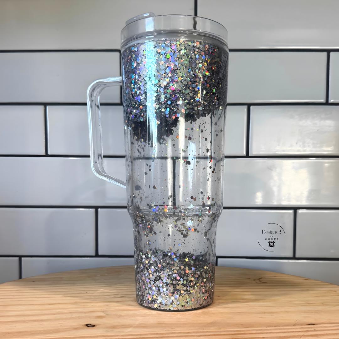 Full silver holographic sparkle tumbler standing against white tile background