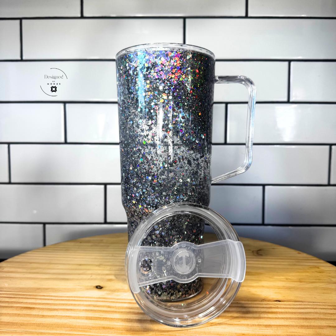 Silver holographic glitter tumbler with clear slide lid shown in front