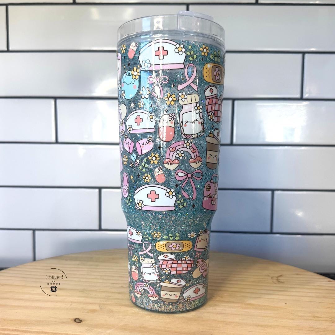 Back view of nurse-themed tumbler with nurse hats, pills, and medical icons.