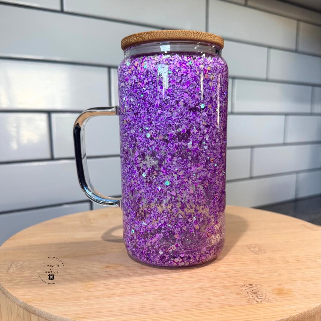 Purple glitter glass tumbler with handle on display