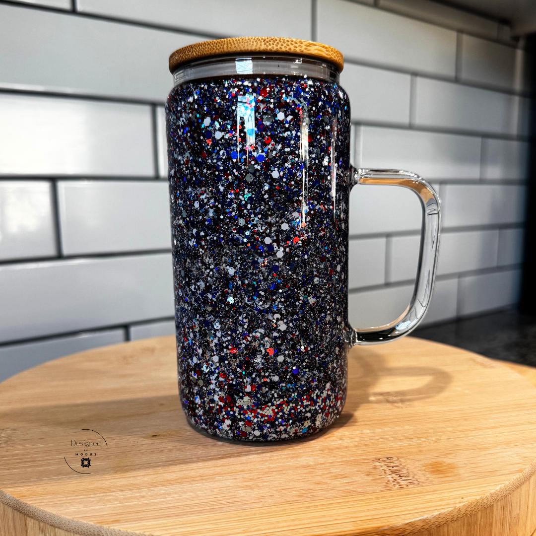 Dark galaxy glitter tumbler with red, white, blue accents