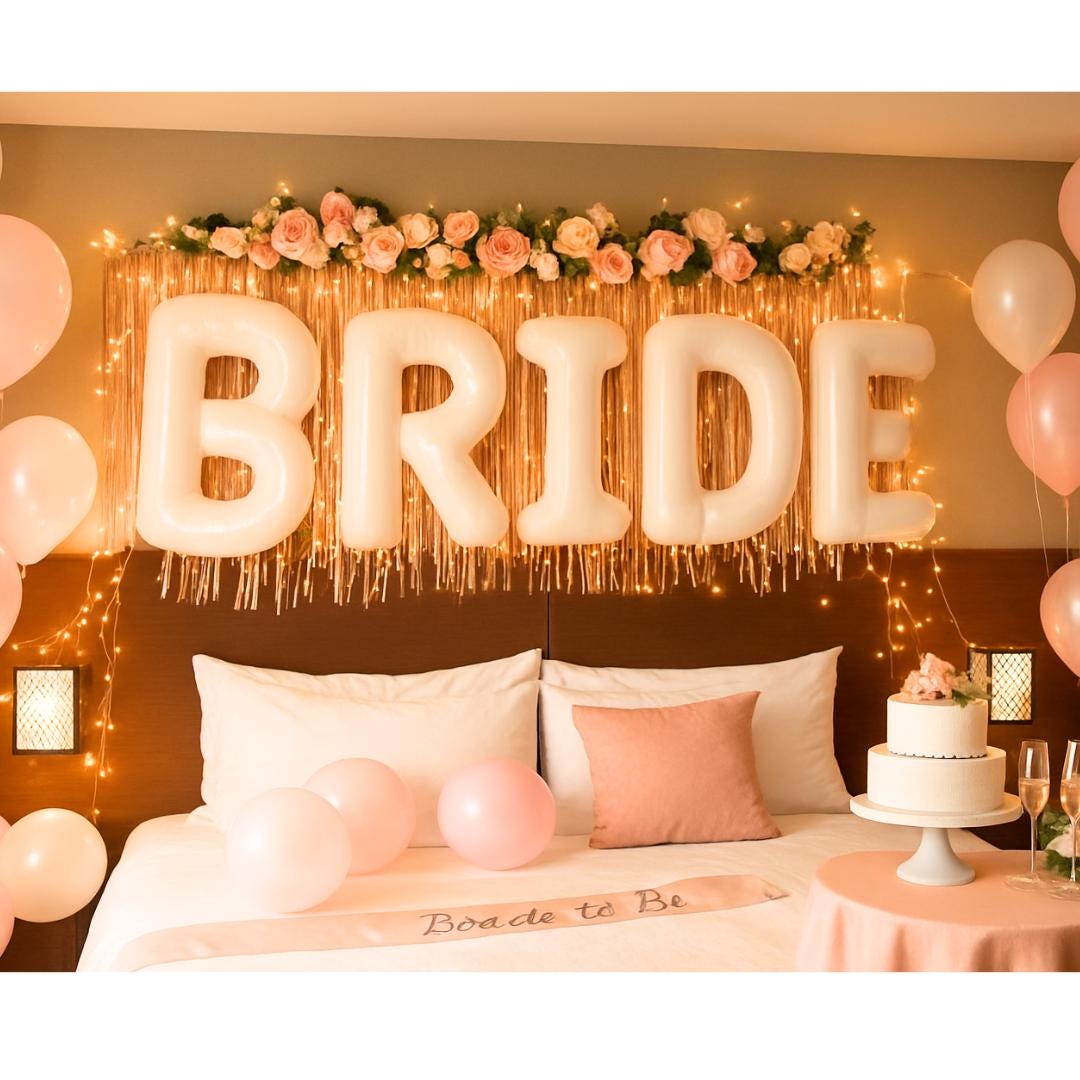 BRIDE balloons hanging above two beds with bunting banner