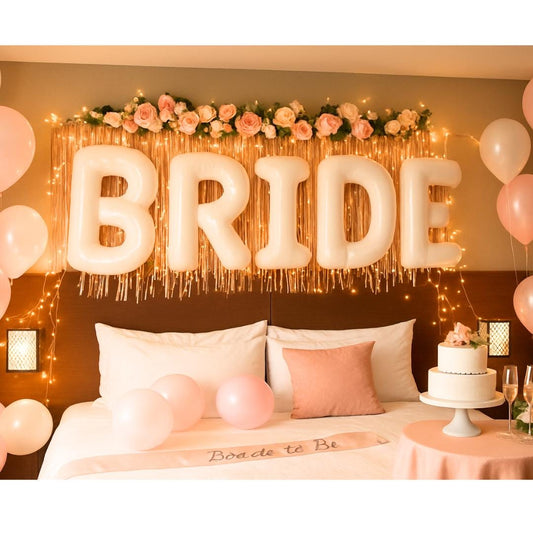 BRIDE balloons hanging above two beds with bunting banner