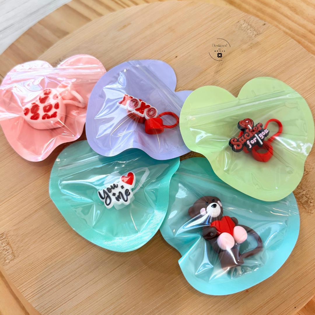 Heart zip bags filled with small charms for Valentine gift ideas