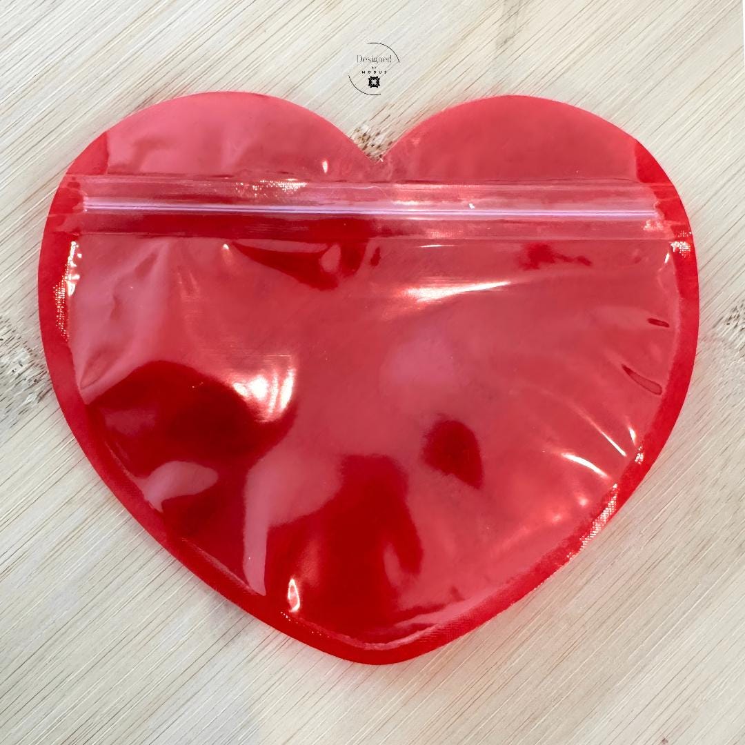 Red heart pouch showing zip closure detail
