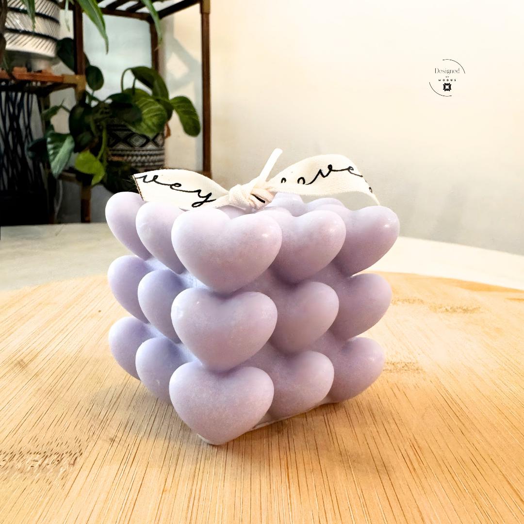 Heart cube candle with stacked heart design in soft pastel color