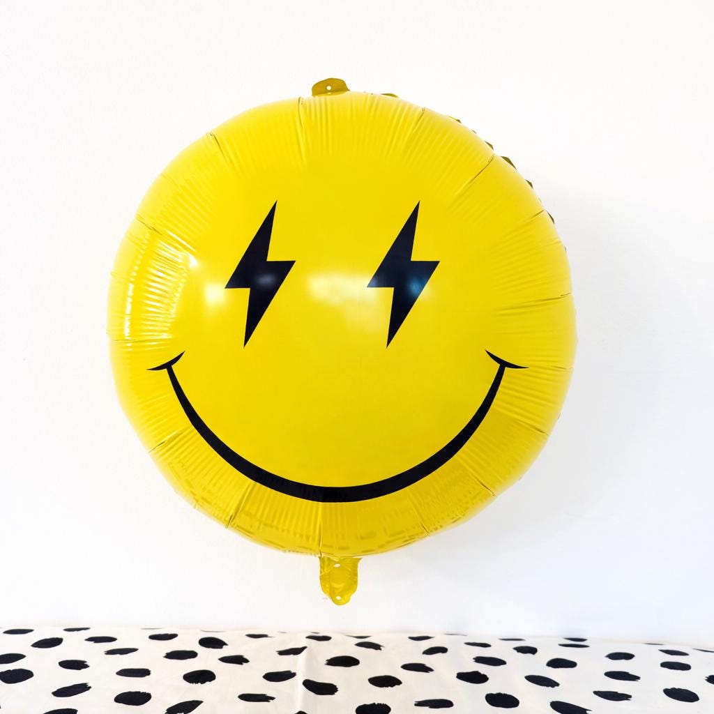 Pink Smiley Balloon with Lightning Eyes – Retro Happy Face Mylar Party Decoration