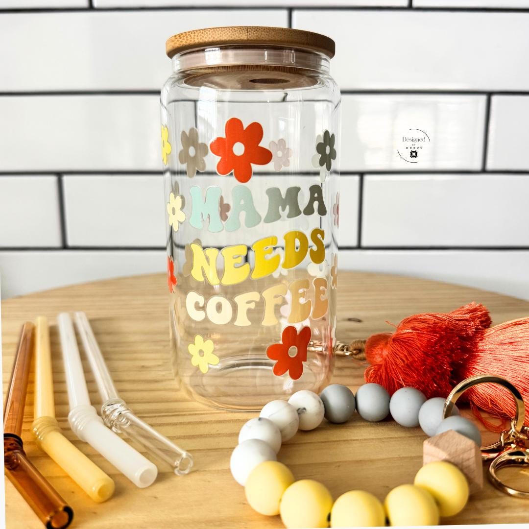 Mama Needs Coffee Tumbler Glass Straw Set Bamboo Lid Reusable Drinkware 16 Oz Capacity Retro Flower Design Orange Yellow Sage Green Cream Mothers Day Gift Mom Birthday Present Beaded Wristlet Keychain Eco Friendly Sustainable Coffee Cup