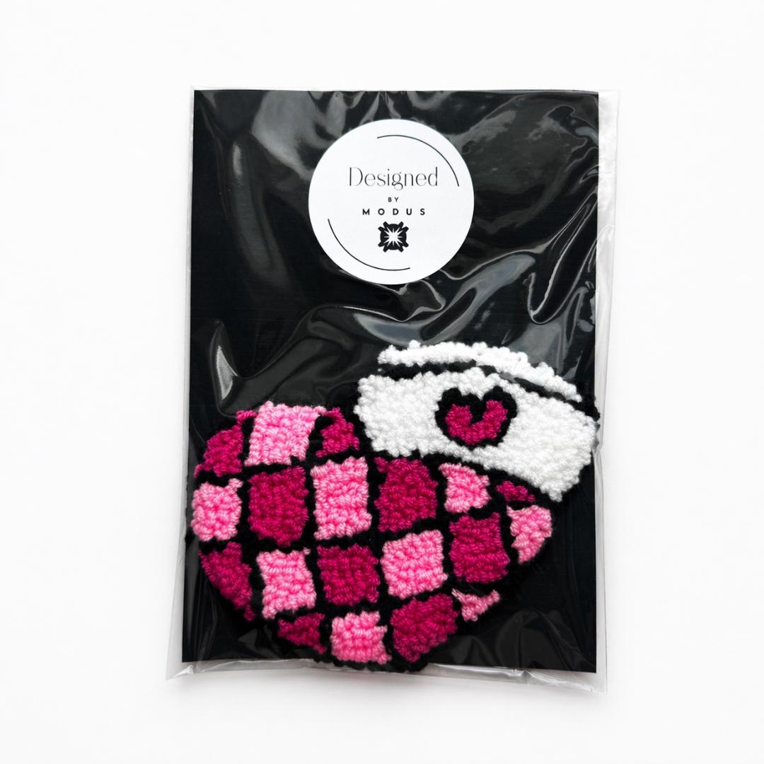 Crocheted Coffee Coaster Handmade Mug Rug Cotton Yarn Pink Checkered Design Coffee Cup Shape Heart Detail White Cup Black Outline Kitchen Table Protection Perfect Mom Birthday Gift Coffee Station Desk Accessory Coffee Enthusiast Present