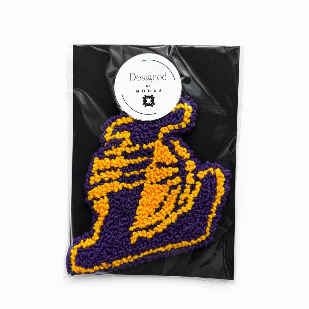 Purple Gold Team Color Basketball Coaster Handmade Cotton Yarn Mug Rug Sports Theme Gift Coffee Table Protection Drink Mat Textured Surface Looped Pile Design Office Desk Accessory Fan Present Basketball Shape Curved Lines Border Beautiful