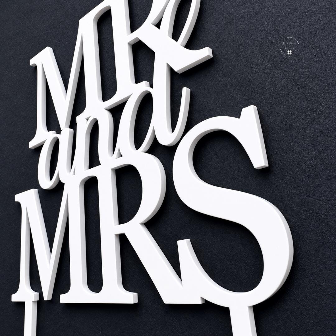 Ceremony Ornament Wedding Cake Topper Mr Mrs Cursive Script Lettering Acrylic Sign Bride Groom Heart Design Detail Reception Centerpiece Table Display Romantic Couple Marriage Celebration Elegant Black White Options Premium Quality Nine By