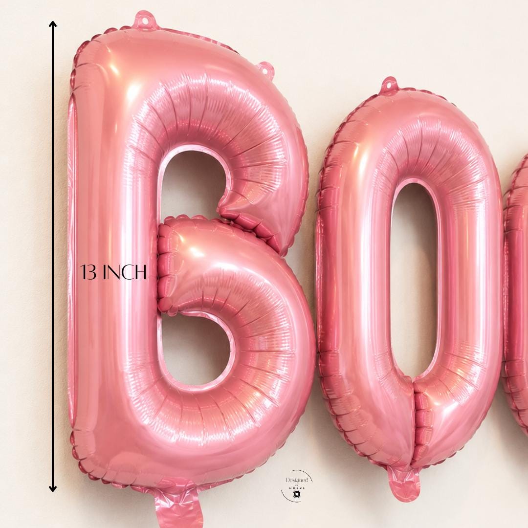 Halloween Party Backdrop Pink Balloons BOO Letter Set Mylar Foil Party Supplies Metallic Rose Gold Theme Photo Prop Display Thirteen Inch Tall Air Filled Balloons Trick Treat Event Celebration Spooky Season Party Styling Modern Halloween