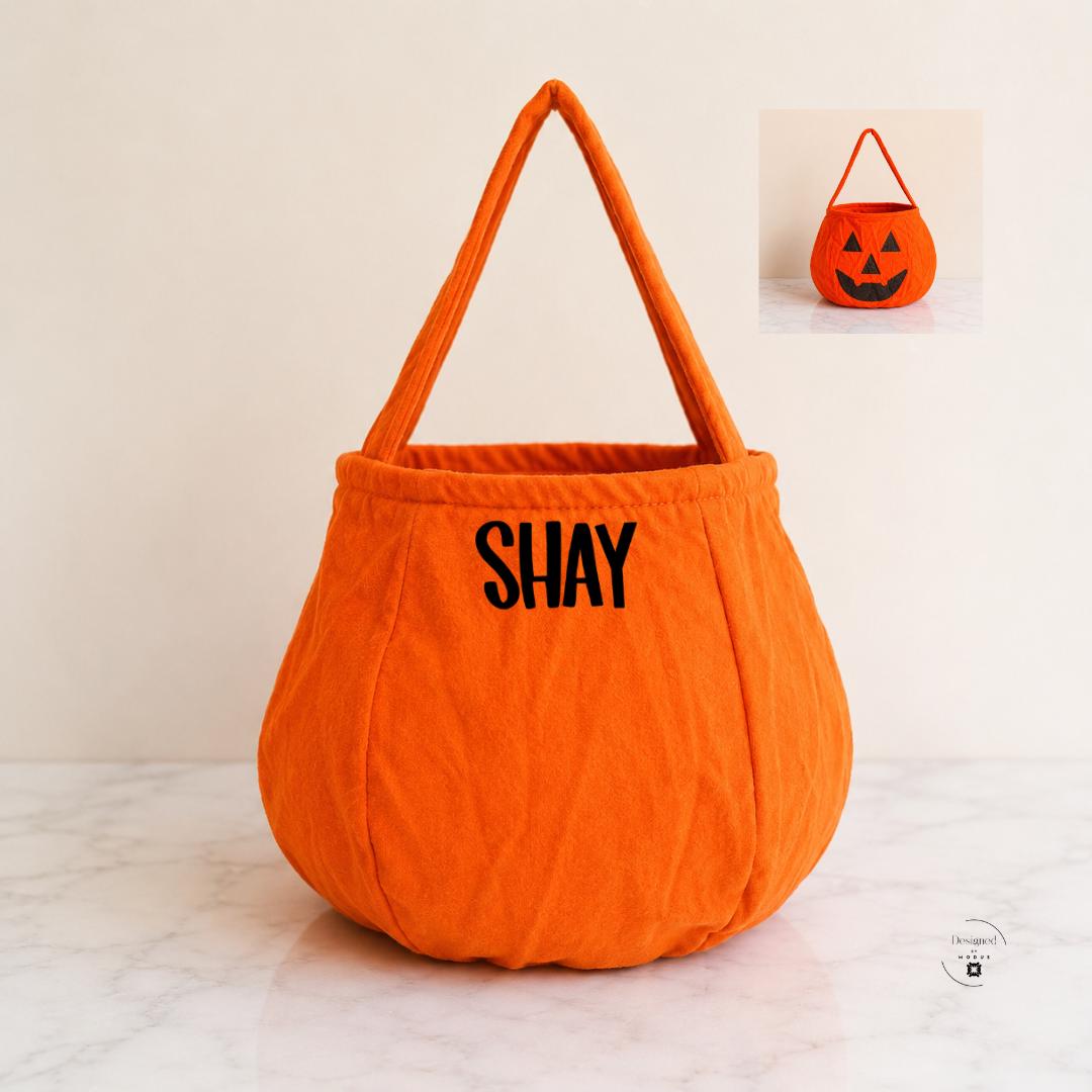Custom Halloween trick or treat tote for boys and girls with personalized name and choice of colorful pumpkin bag