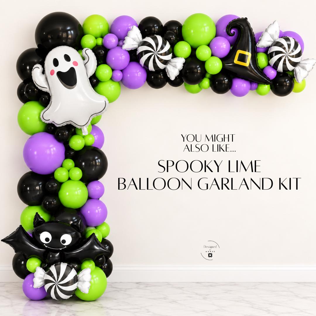 Black green and purple Halloween balloon arch displayed around a decorated classroom door. Lime After Dark combines black, electric lime green and lavender purple balloons for modern spooky party decor. DIY Halloween garland for school parties, classroom decorating, Halloween birthdays, kids events, party entrances, photo booths and trick or treat celebrations.
