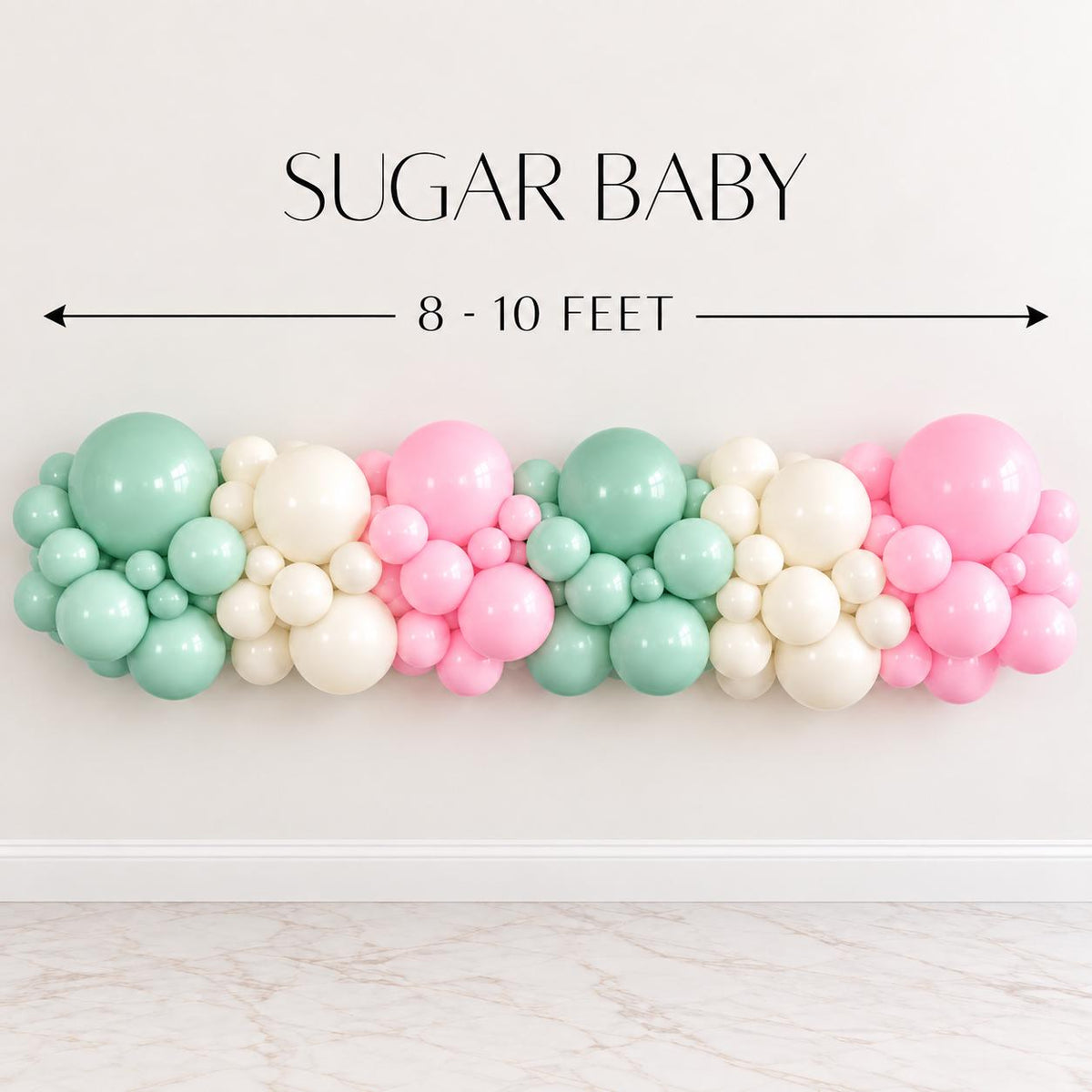 DIY Christmas balloon arch kit featuring mint green, white and pink balloons for a modern pastel holiday color palette. Festive Christmas party decoration for dessert tables, fireplaces, entryways, birthday celebrations, kids holiday parties, winter events, Candyland Christmas themes and seasonal photo backdrops.