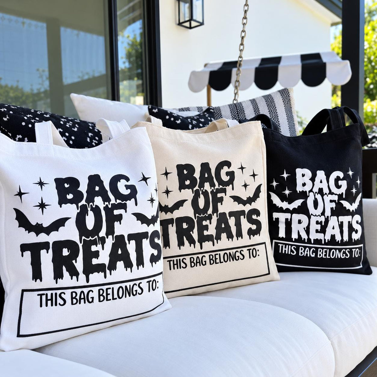 Personalized Halloween trick or treat bag for kids featuring a custom name and festive Halloween design. This reusable cotton candy tote is perfect for collecting treats on Halloween night, attending school parties, fall festivals and neighborhood trick or treating. A practical personalized Halloween gift for boys and girls that can be customized with your child’s name.