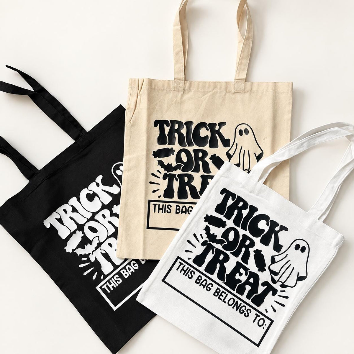 Custom ghost Halloween candy bag personalized with a child’s name for trick or treating. This cotton trick or treat tote is available in black, natural or white and makes a cute Halloween accessory for kids. Perfect for collecting candy at neighborhood trick or treating, trunk or treat, Halloween parties, classroom celebrations and spooky season events.
