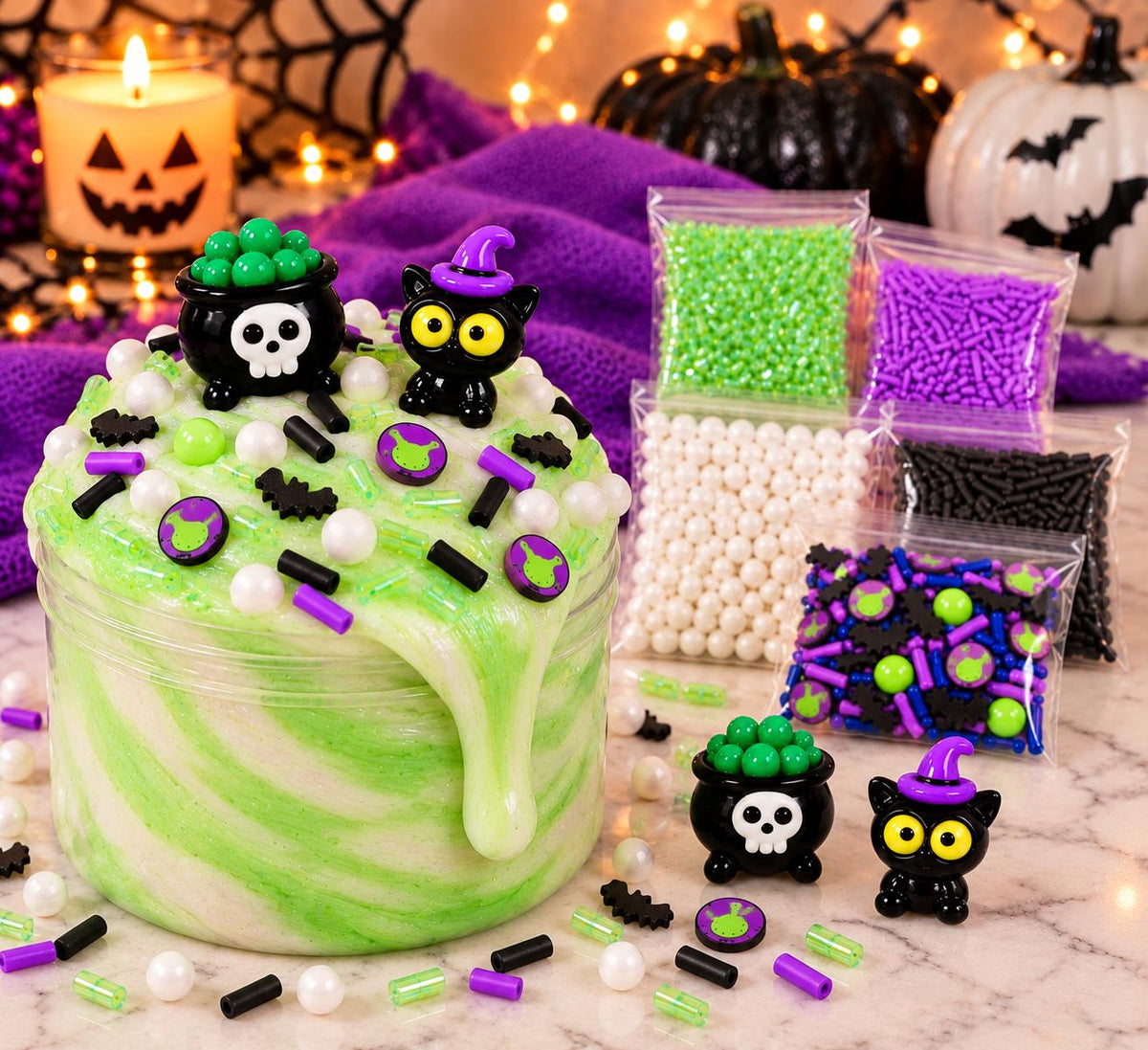 Kids Halloween slime activity kit with premade slime, green dye, Halloween sprinkle mix, witch and black cat charms, apron and slime activator. Custom DIY slime kit designed for Halloween parties, kids birthday parties, classroom celebrations, playdates, sensory activities and party favors. Spooky slime making activity lets children decorate and customize their slime with colorful sprinkles and Halloween charms for hands on creative play.