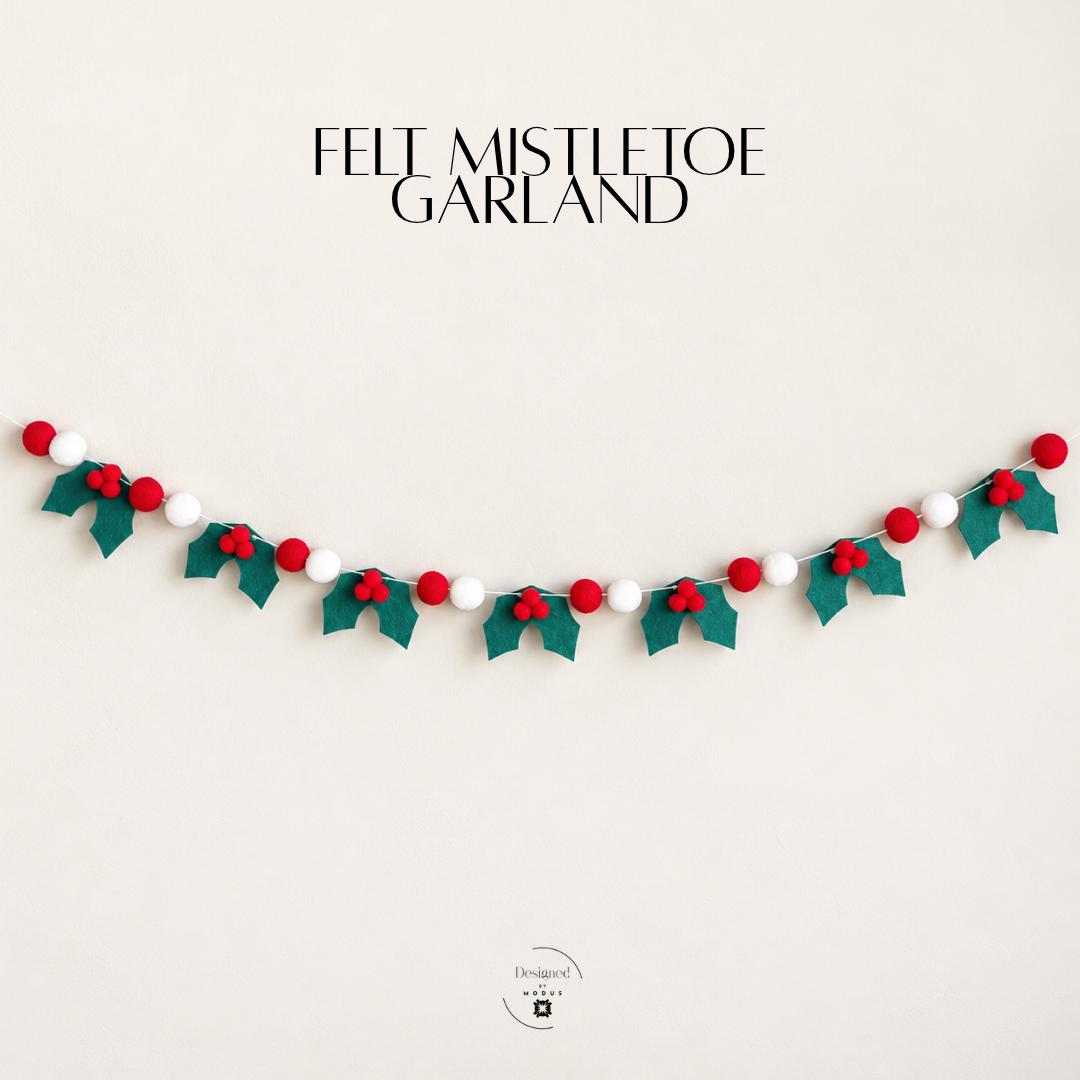 Minimalist Christmas holly garland featuring dark green felt holly leaves with red berry clusters and alternating red and white pom poms on a light colored string. Simple traditional holiday decoration for Christmas mantels, shelves, classroom walls, festive doorways, holiday dessert tables and cozy seasonal home decor. Cheerful Christmas banner for farmhouse holiday decorating, Christmas parties, office celebrations and winter gatherings.